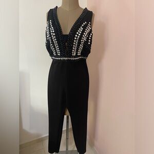 Black jumpsuit with stones and back and front cut out!